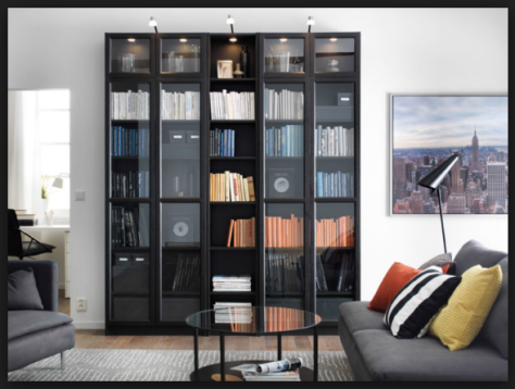 tall wooden bookcase with doors